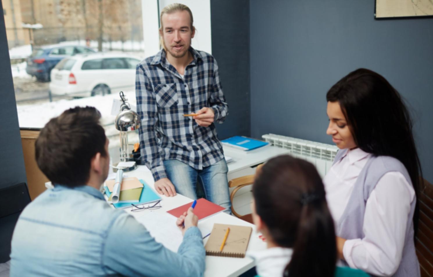 Financial analysis workspace showing charts and data visualization on computer screens